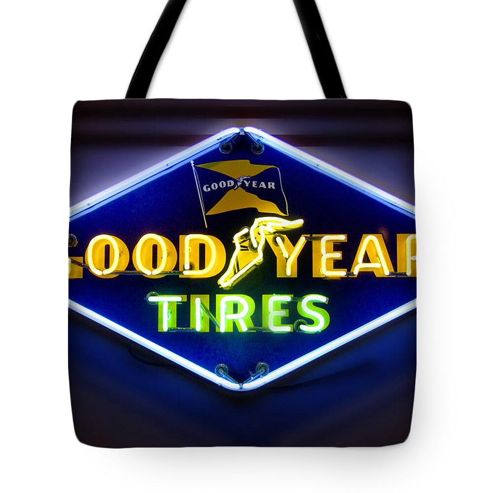 Transportation Tote Bag featuring the photograph Neon Goodyear Tires Sign by Mike McGlothlen