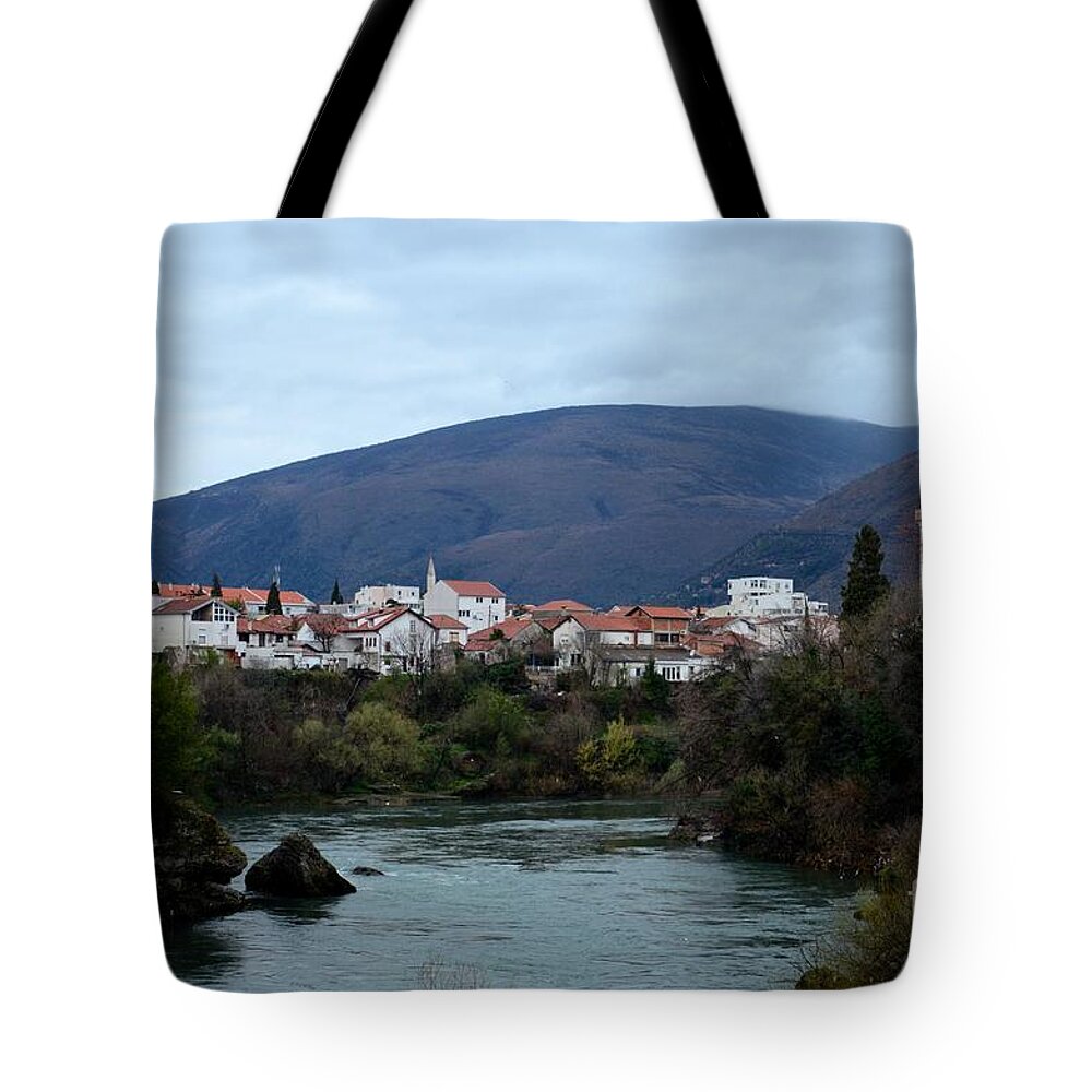 Mostar Tote Bag featuring the photograph Neretva River and Mostar city and hills with mosque minaret Bosnia Herzegovina by Imran Ahmed