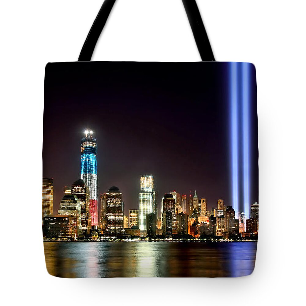 New York City Skyline At Night Tote Bag featuring the photograph New York City Skyline Tribute in Lights and Lower Manhattan at Night NYC by Jon Holiday