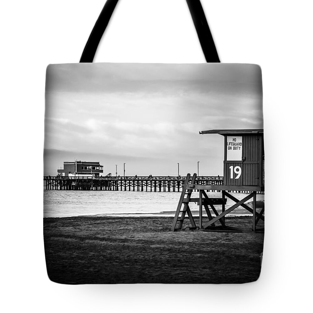 America Tote Bag featuring the photograph Newport Pier and Lifeguard Tower in Black and White by Paul Velgos