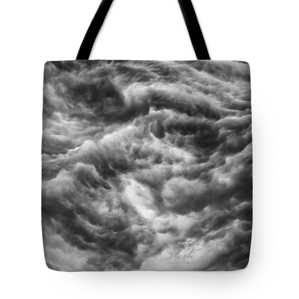 Storm Clouds Tote Bag featuring the photograph No where to go by Charles McCleanon
