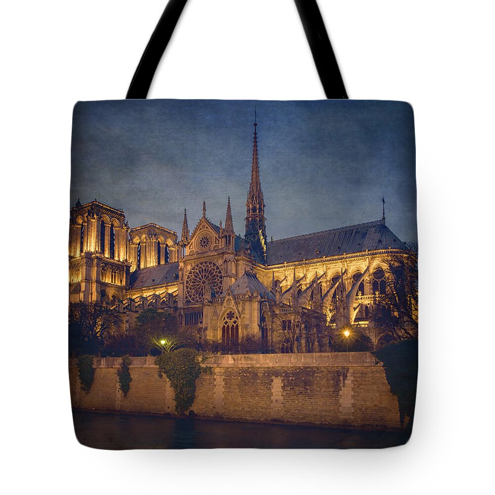 Joan Carroll Tote Bag featuring the photograph Notre Dame on the Seine Textured by Joan Carroll