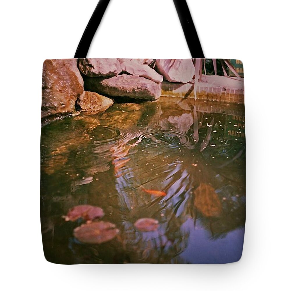 Oasis Tote Bag featuring the photograph Oasis in the city centre by Marina Martynova