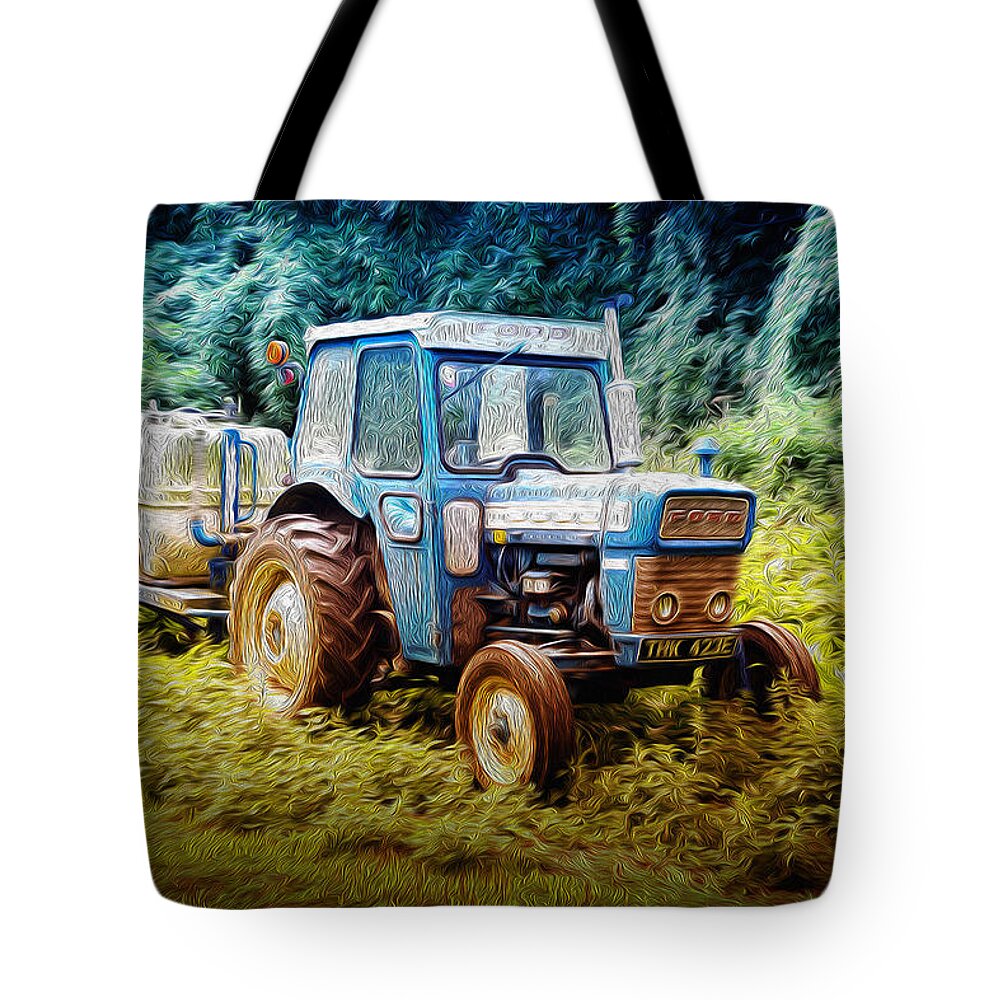 John D Williams Tote Bag featuring the photograph Old Blue Ford Tractor by John Williams