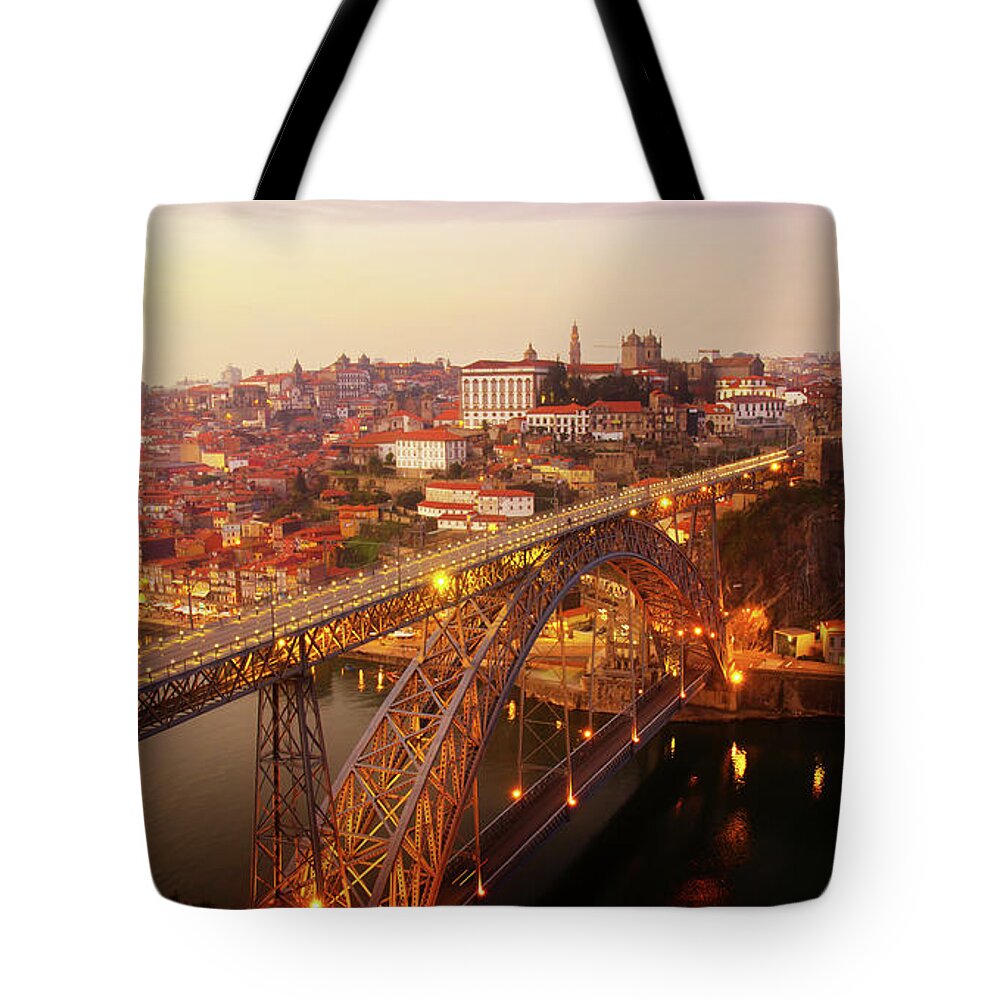 Sunset Tote Bag featuring the photograph old Porto at Pink Sunset, Portugal by Anastasy Yarmolovich