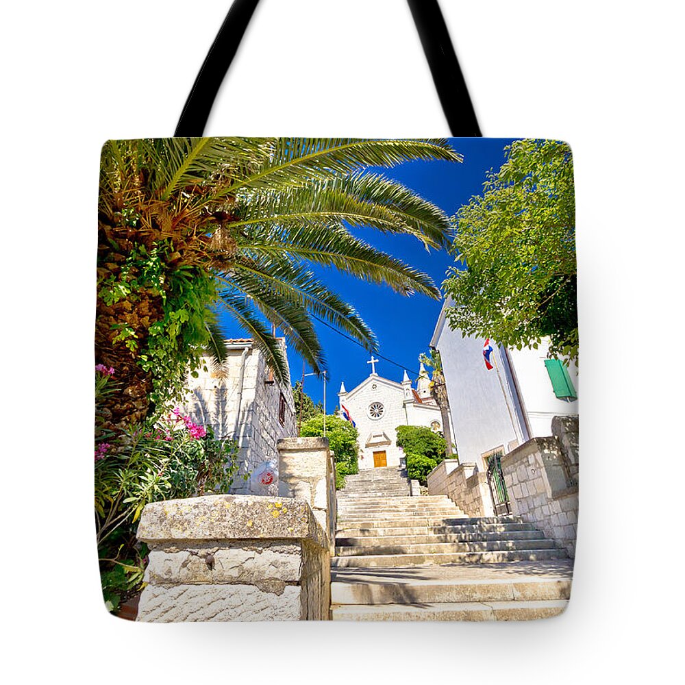 Rogoznica Tote Bag featuring the photograph Old stone street and church in Rogoznica by Brch Photography