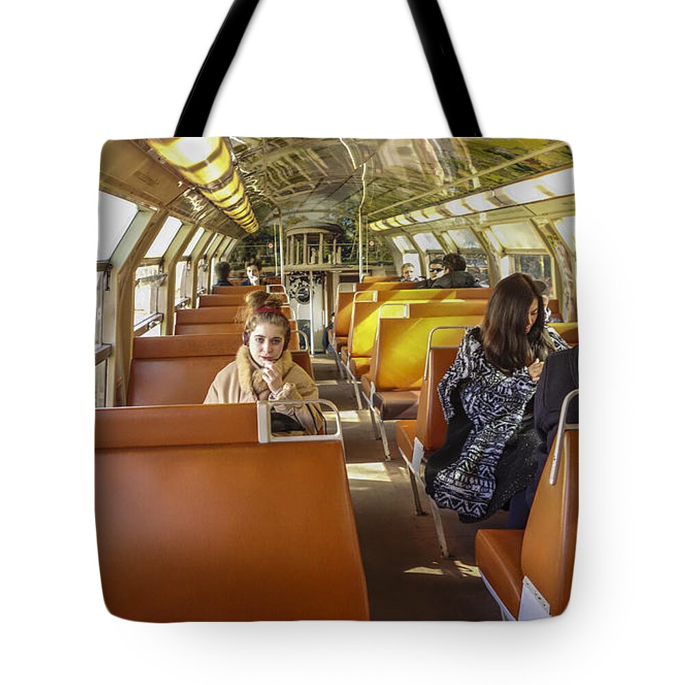Train Tote Bag featuring the photograph On a Train by Matthew Bamberg