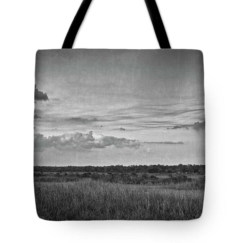Black And White Tote Bag featuring the photograph On the Edge by Roberto Aloi