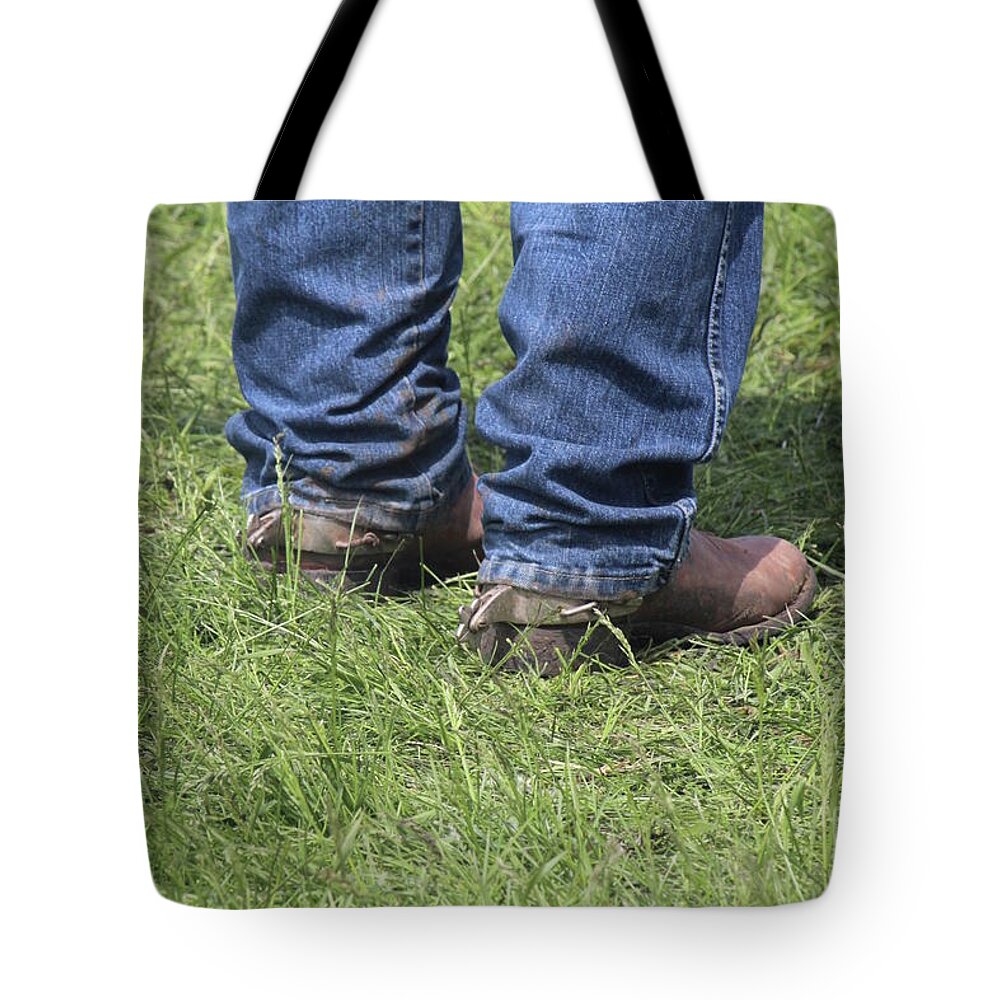Cowboy Tote Bag featuring the photograph On the Ground by Ann E Robson
