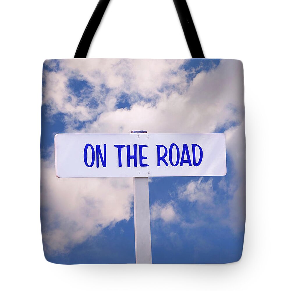 On The Road Tote Bag featuring the photograph On the Road Sign by Phil Cardamone