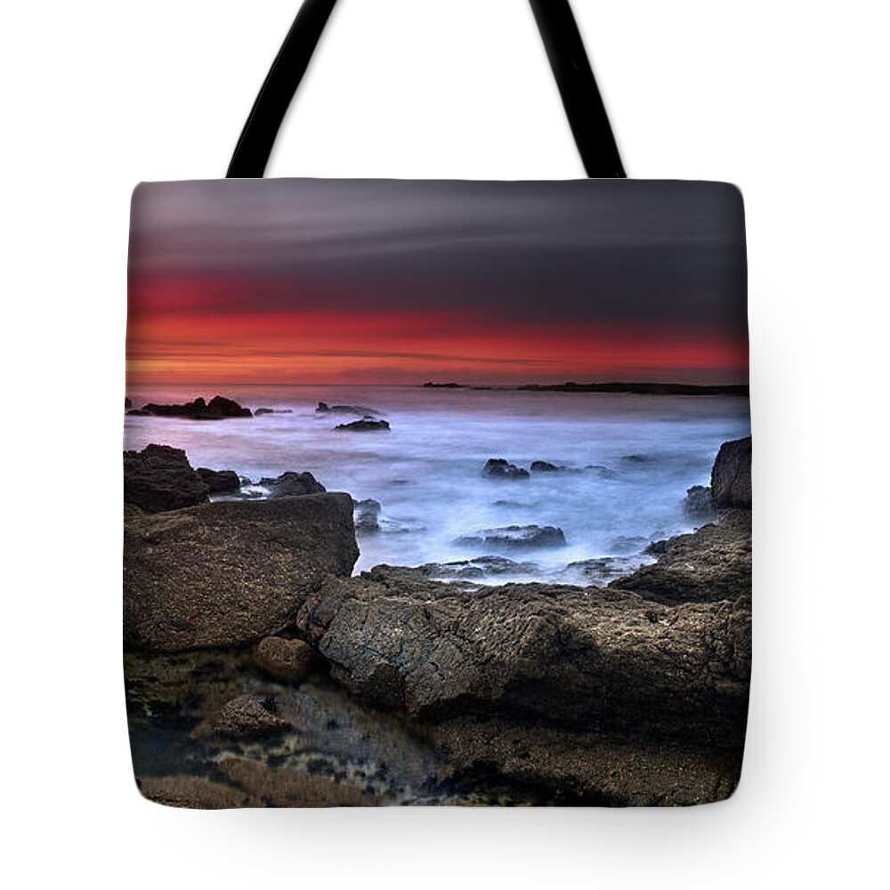 #rainbow #john #chivers #seascape #landscape #cornwall #rocks #rocky #colourful #interesting #beautiful #magical #fantastic #stunning #relaxing #sand #sea #waves #crashing #panoramic #long #red Tote Bag featuring the photograph Opposites Attract by John Chivers