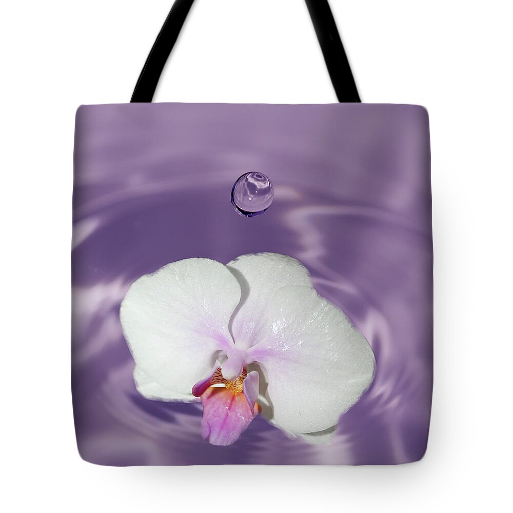 Macro Photography Tote Bag featuring the photograph White Orchid Water Drop by Crystal Wightman