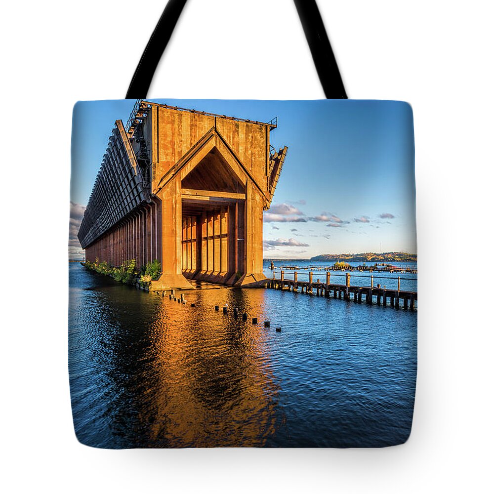 Water Tote Bag featuring the photograph Ore Dock by Joe Holley