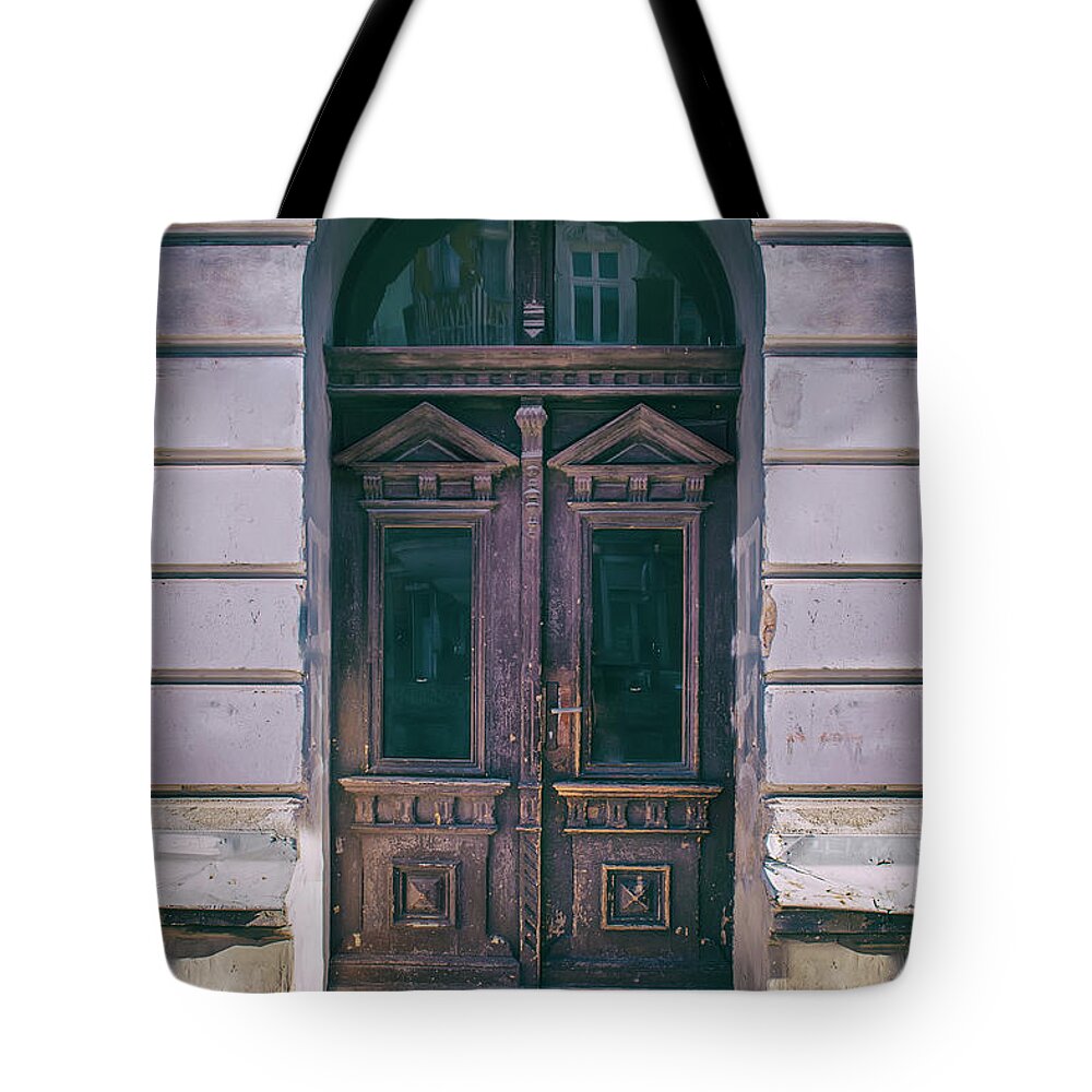 Gate Tote Bag featuring the photograph Ornamented wooden gate in violet tones by Jaroslaw Blaminsky