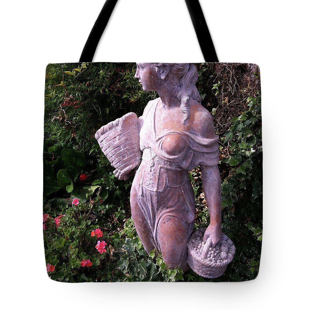 Statue Tote Bag featuring the photograph Out In The Garden by Donna Blackhall