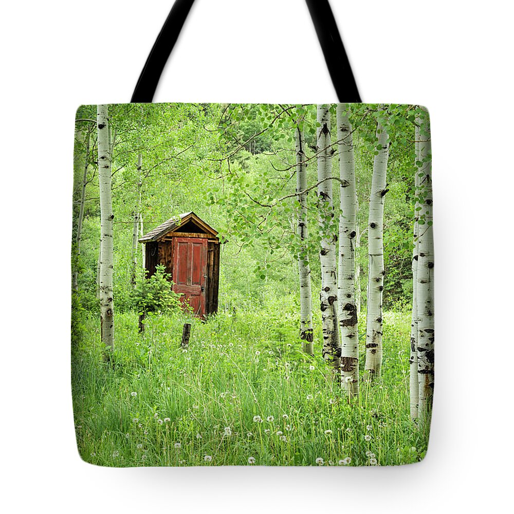 Red Door Tote Bag featuring the photograph Outhouse With Red Door by Denise Bush