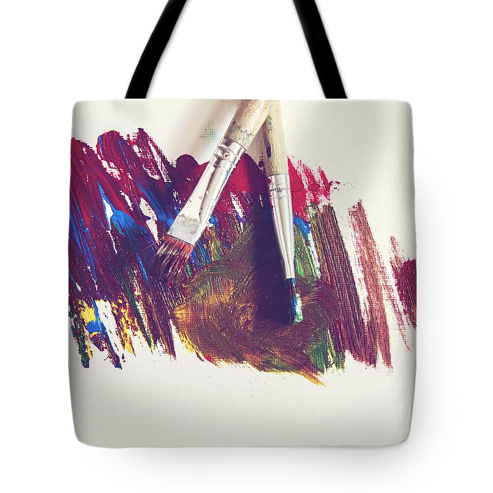 Yellow Tote Bag featuring the photograph Paint smeared on paper by Sophie McAulay