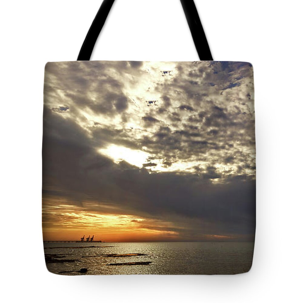 Sunset Tote Bag featuring the photograph Panorama of the sunset in Caesarea by Adriana Zoon