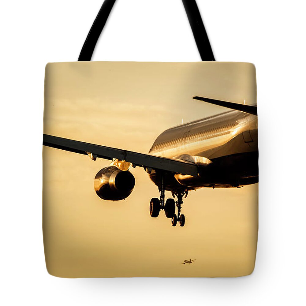 Aircraft Tote Bag featuring the photograph Aircraft Landing at Sunset by Rick Deacon