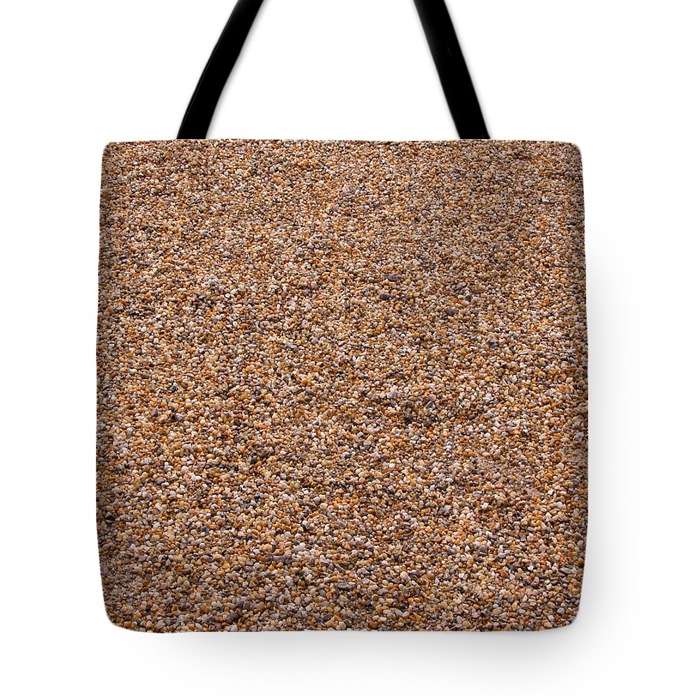 Abstract Tote Bag featuring the photograph Pebbles brown nature background by Michalakis Ppalis