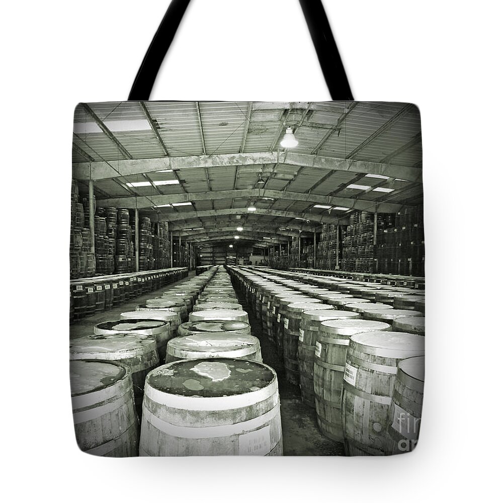 Black And White Tote Bag featuring the photograph Pepper Aging Barrels by Leslie Revels