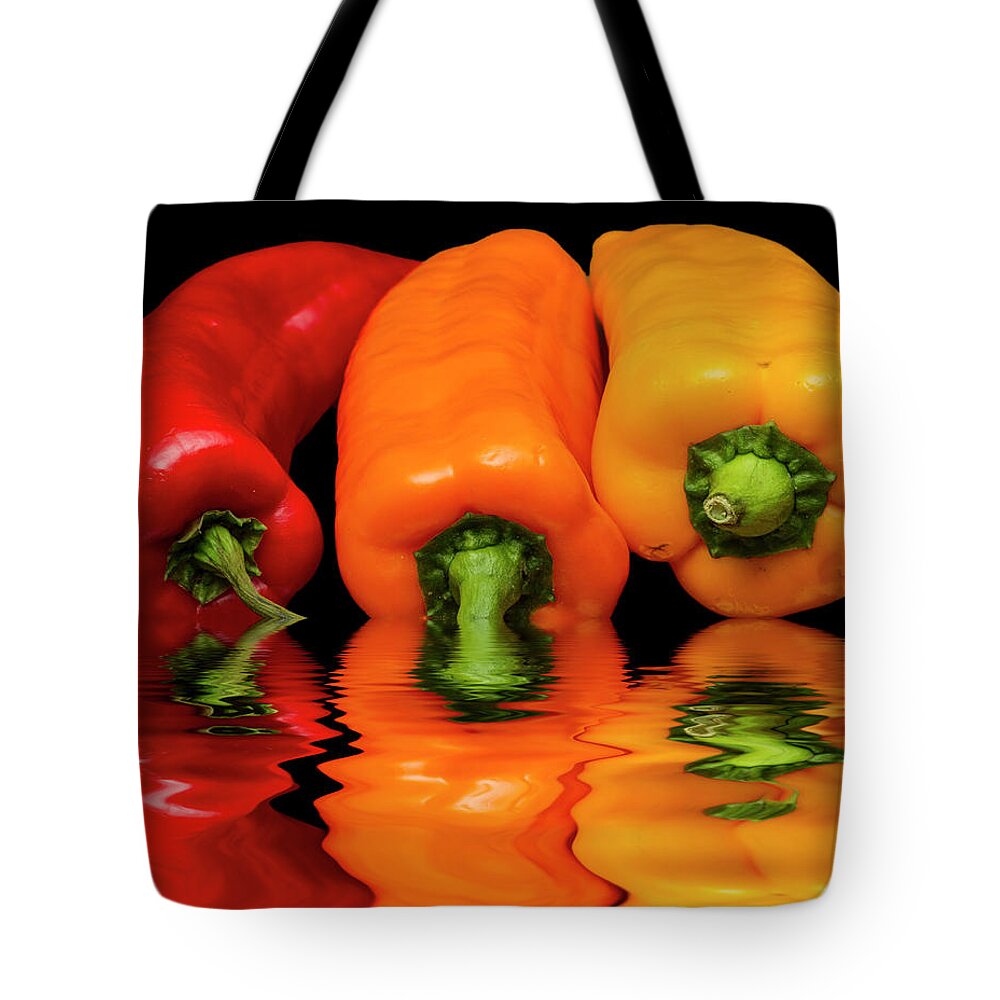 Peppers Tote Bag featuring the photograph Peppers Red Yellow Orange by David French