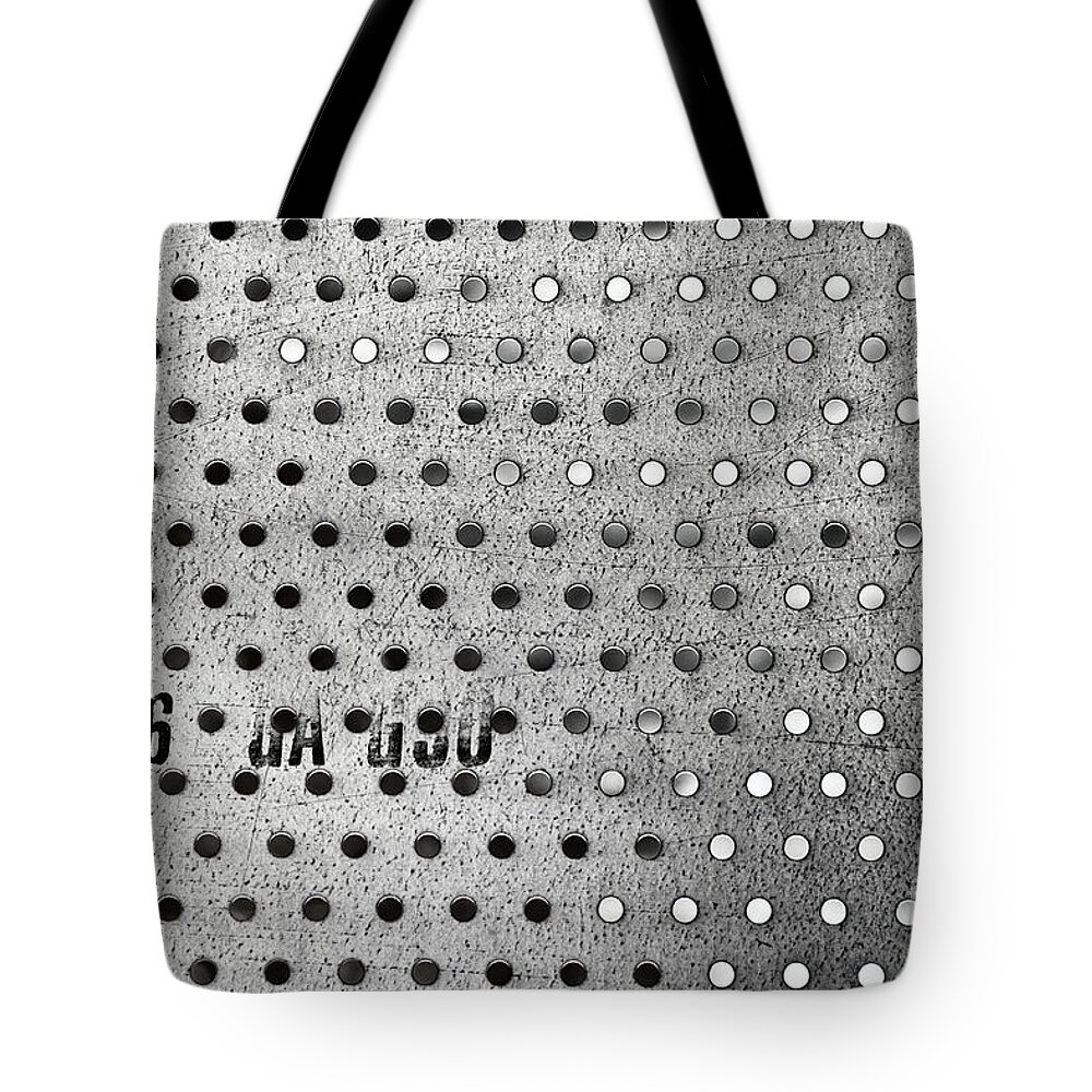 Perforate Perforated Metal Sheel Steel Holes Pattern Black White Monochrome Tote Bag featuring the photograph Perforated Metal 0890 by Ken DePue