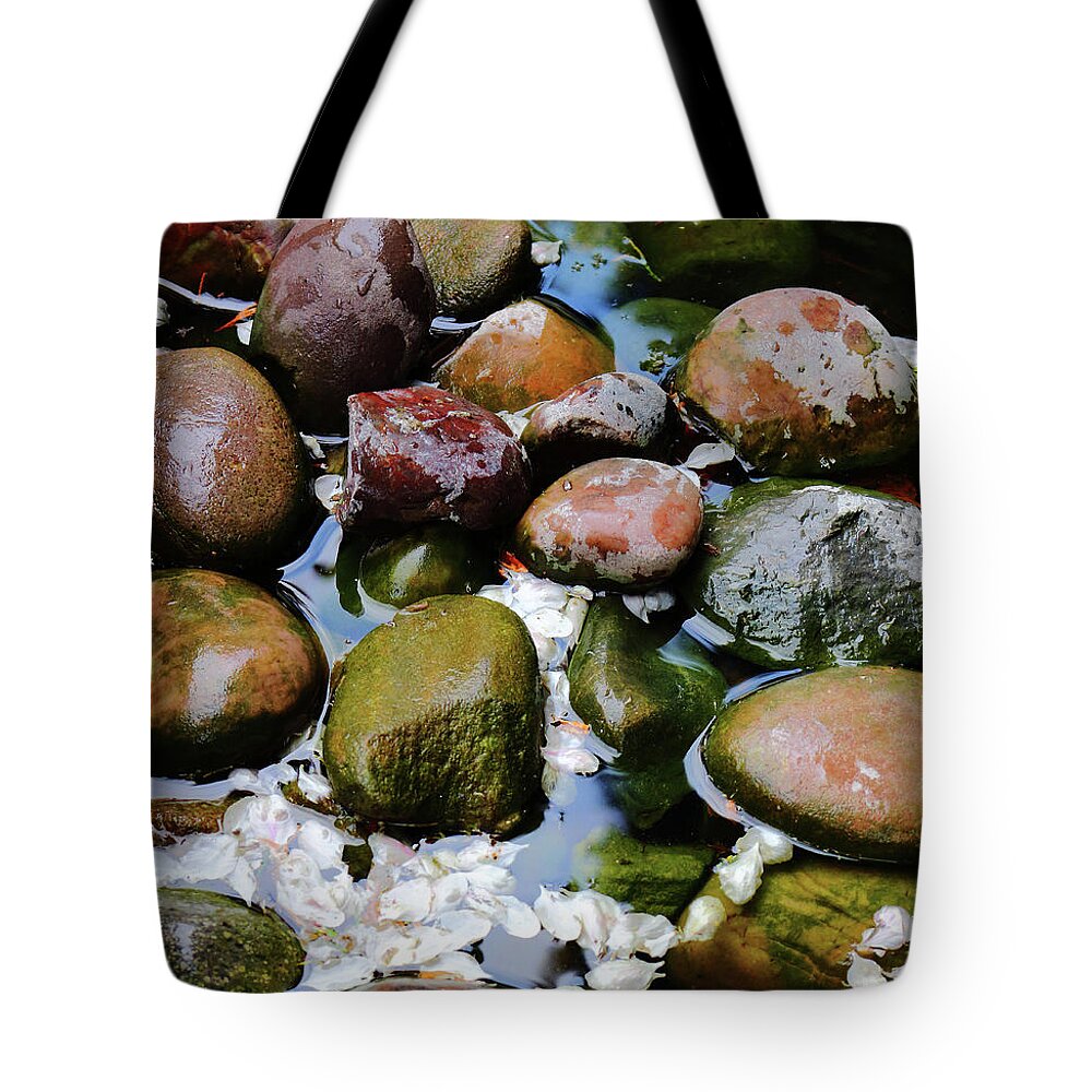 Pond Pebbles Petals Water Stones Red Grey White Nature Light Shade Wet Dry Shapes Round Flat Tote Bag featuring the photograph Petals and Pebbles by Jeff Townsend