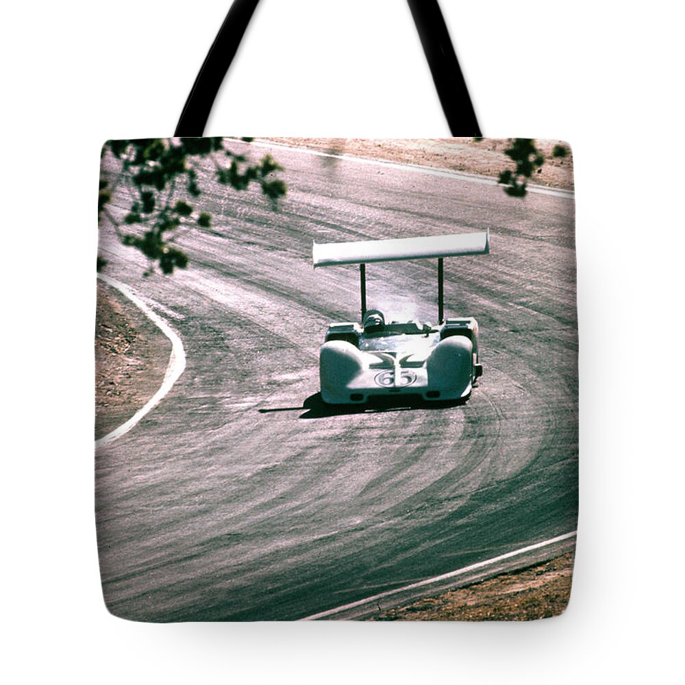 Phil Hill Tote Bag featuring the photograph Phil Hill at Laguna Seca in Chaparral by Dave Allen