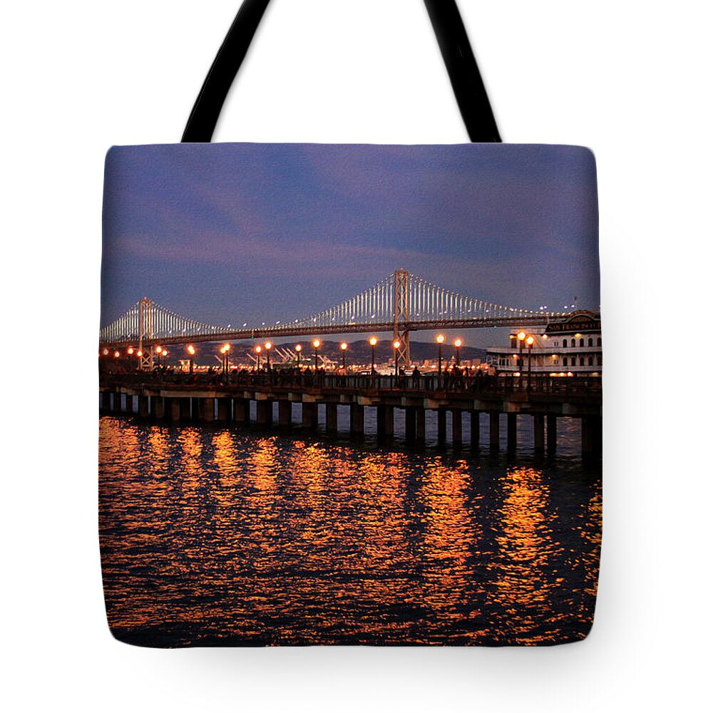 Bonnie Follett Tote Bag featuring the photograph Pier 7 and Bay Bridge Lights at Sunset photo painting by Bonnie Follett
