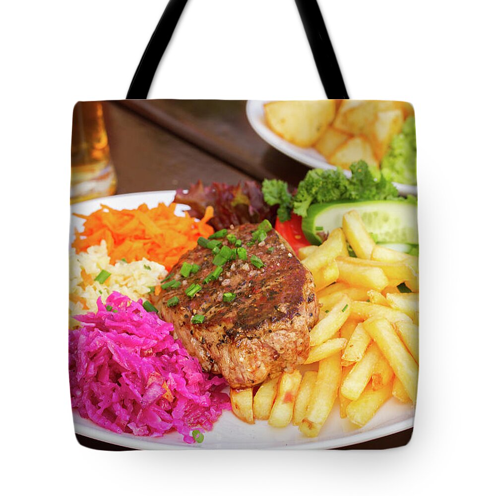 Steak Tote Bag featuring the photograph Plate of Steak with Garnish by Anastasy Yarmolovich