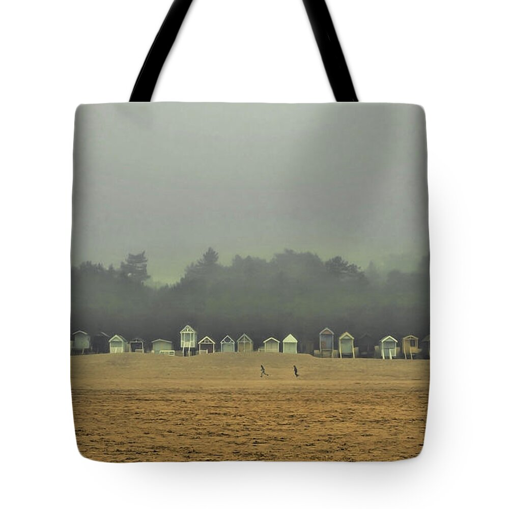 Wells Tote Bag featuring the photograph Playing on the Foggy Beach by Nick Bywater