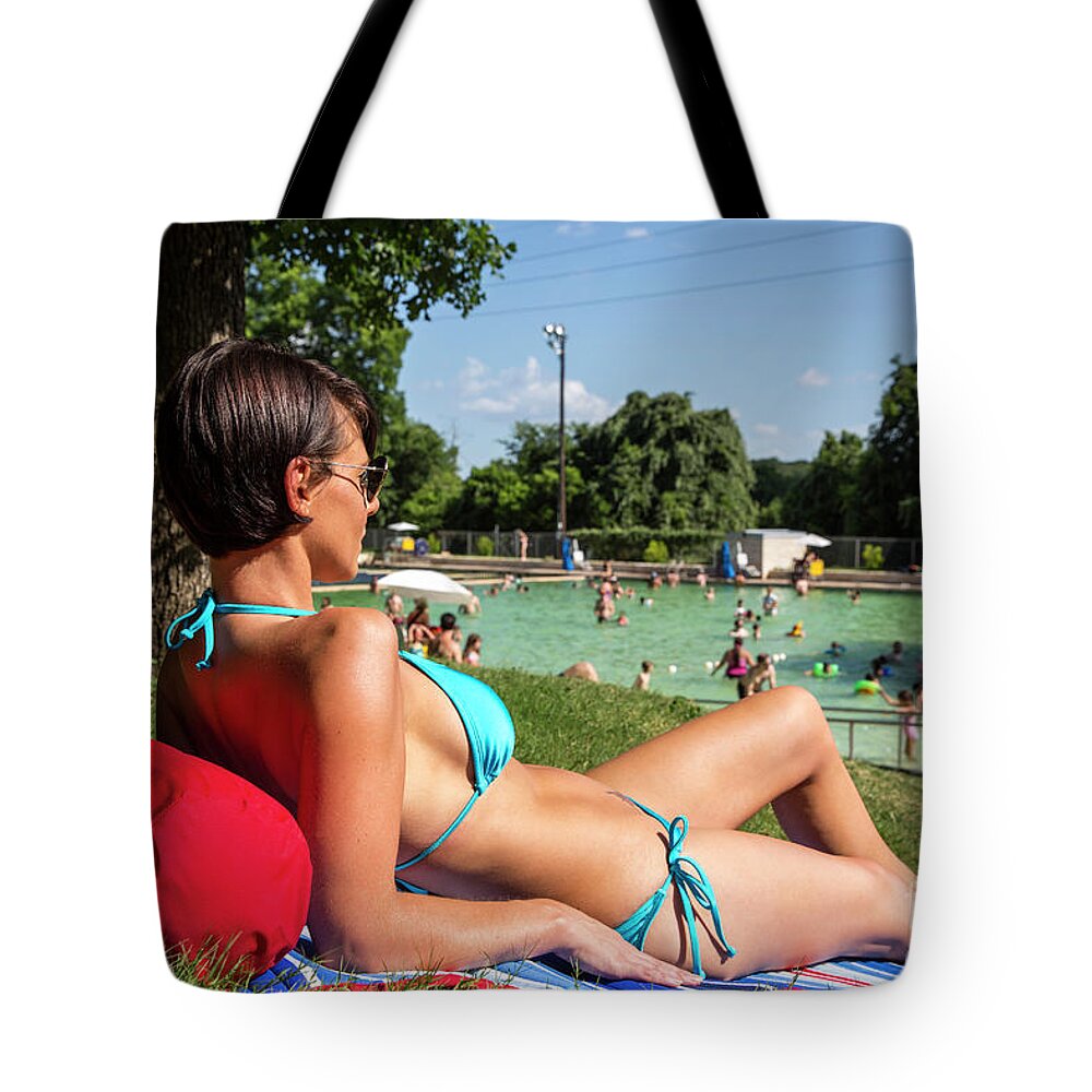 Deep Eddy Pool Tote Bag featuring the photograph Portrait of a sexy young woman having sunbathing on a beach towel at Deep Eddy Pool, Austin, Texas by Dan Herron