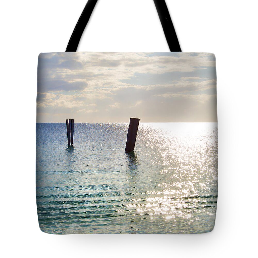 Puerto Morelos Tote Bag featuring the photograph Posts Ripples and Sun Curve by Allan Van Gasbeck