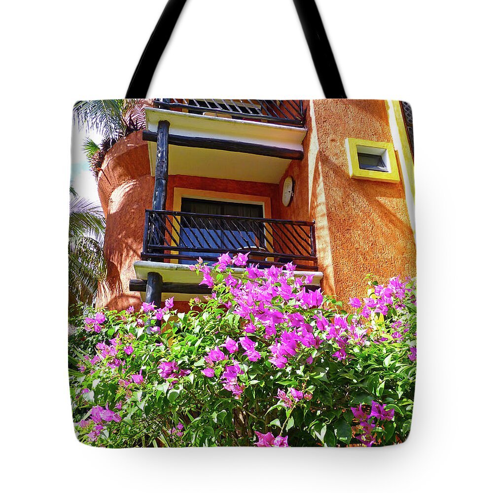 Purple Flowers Tote Bag featuring the photograph Purple flowers by the balcony by Francesca Mackenney