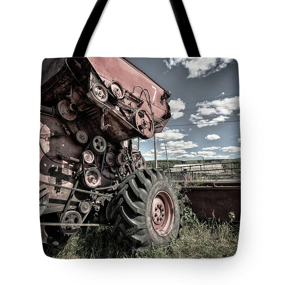 Combine Harvester Tote Bag featuring the photograph Rays of Electricity and The Combine Doth Stop by John Williams