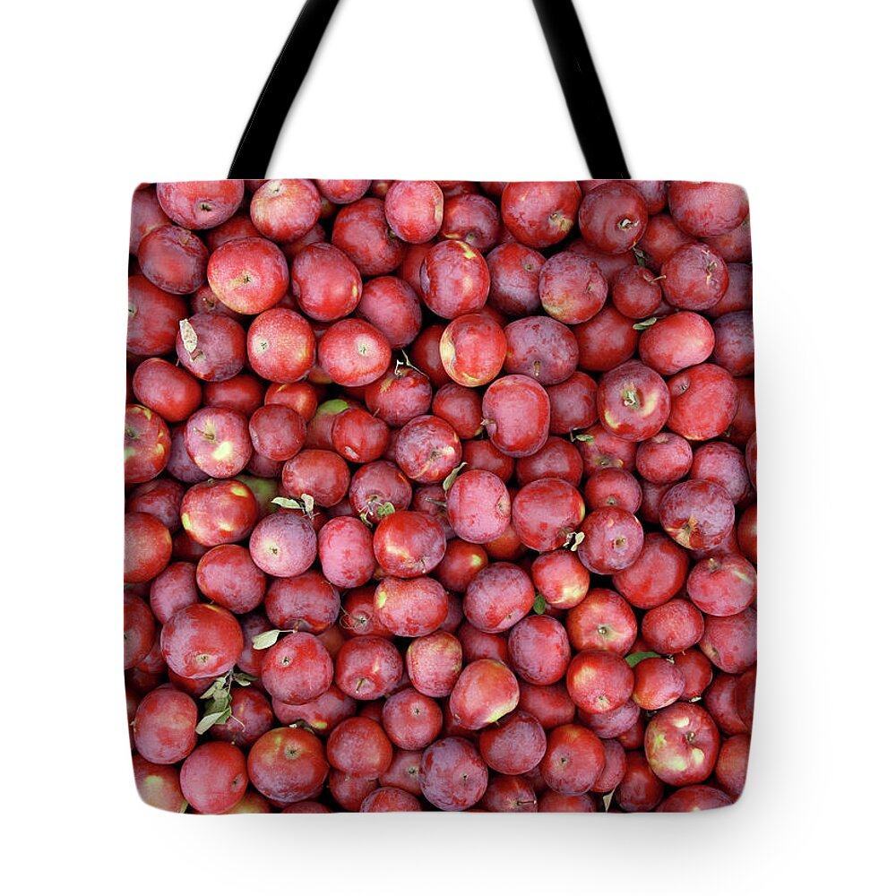 Apple Tote Bag featuring the photograph Red apples background by GoodMood Art