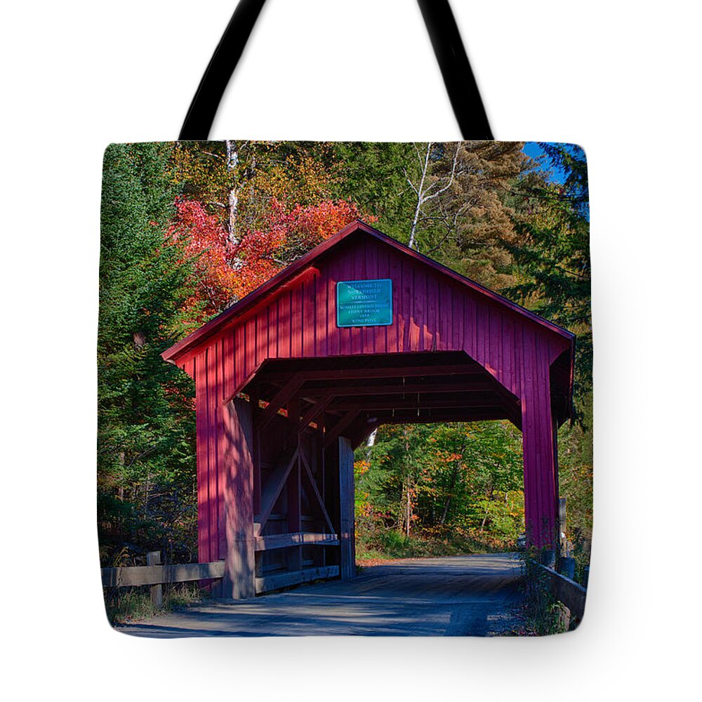 Moseley Covered Bridge Tote Bag featuring the photograph Red autumn foliage over Moseley covered bridge by Jeff Folger