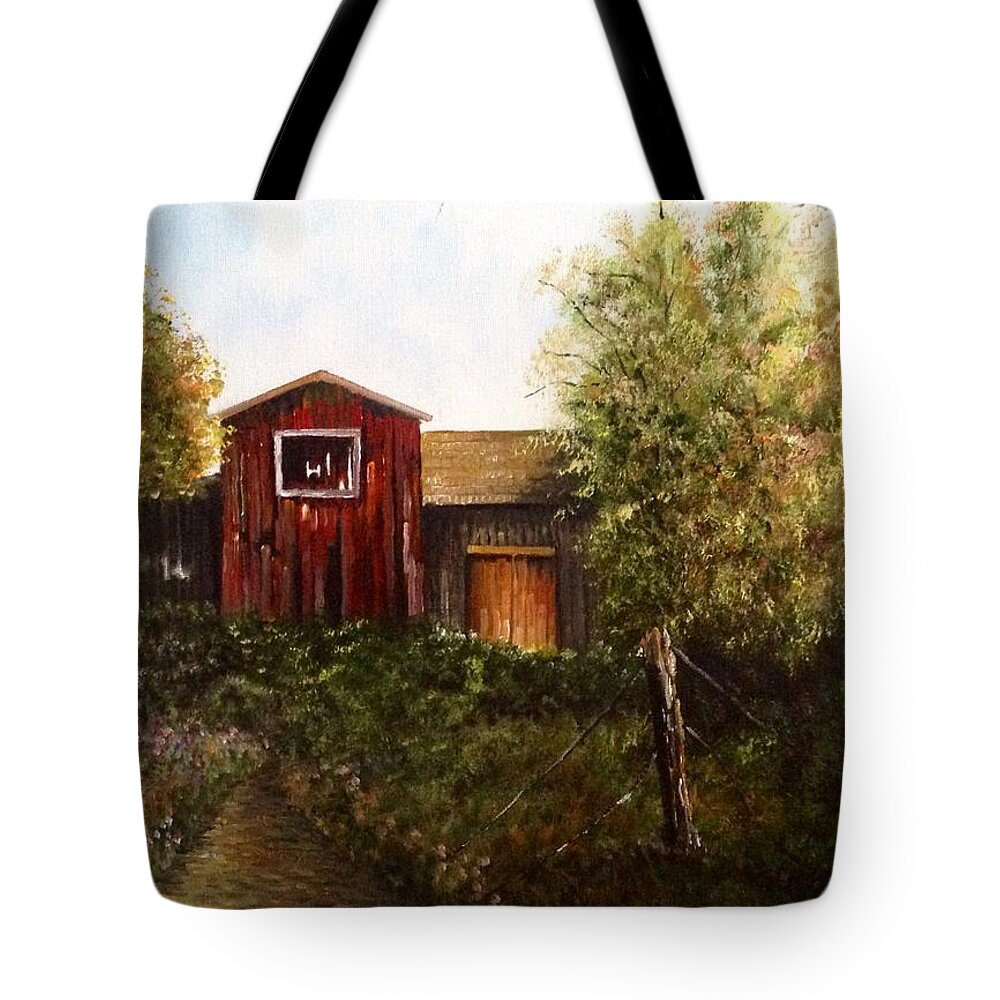 An Old Red Barn With Trees And A Field Of Flowers. There Is A Dirt Pathway Leading To The Front Of The Barn. The Pathway Is Overgrown With Lush Greenery. There Is An Old Fence Post With Wire In The Foreground. Tote Bag featuring the painting Red Barn by Martin Schmidt