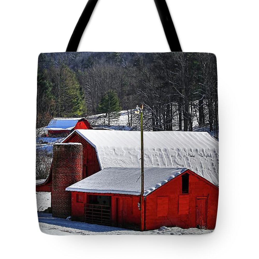 Red Barns And Silo In Snow Tote Bag featuring the photograph Red Barns And Silo In Snow by Carol Montoya