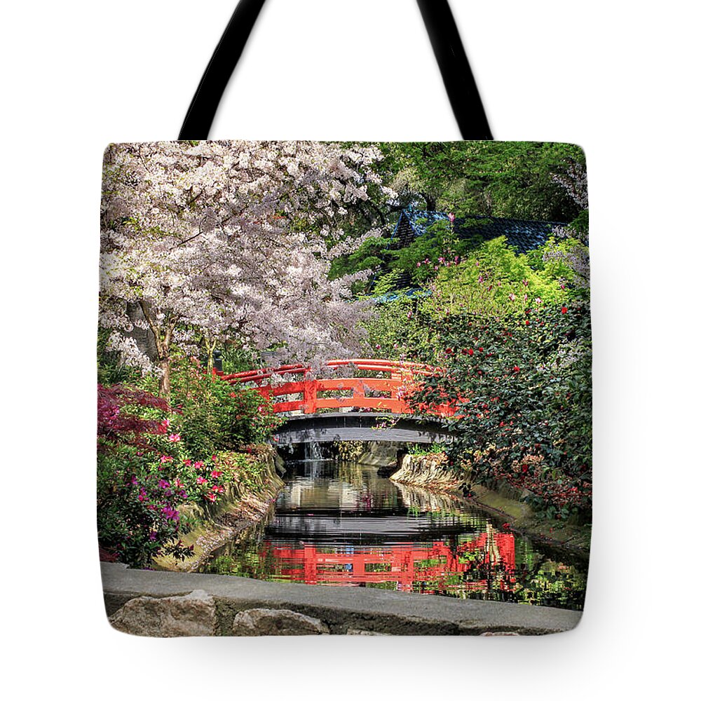 Red Tote Bag featuring the photograph Red Bridge Spring Reflection by James Eddy