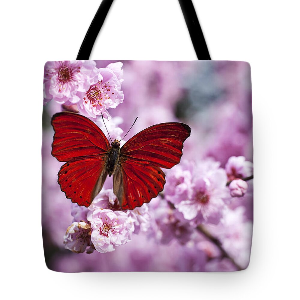 Red Tote Bag featuring the photograph Red butterfly on plum blossom branch by Garry Gay