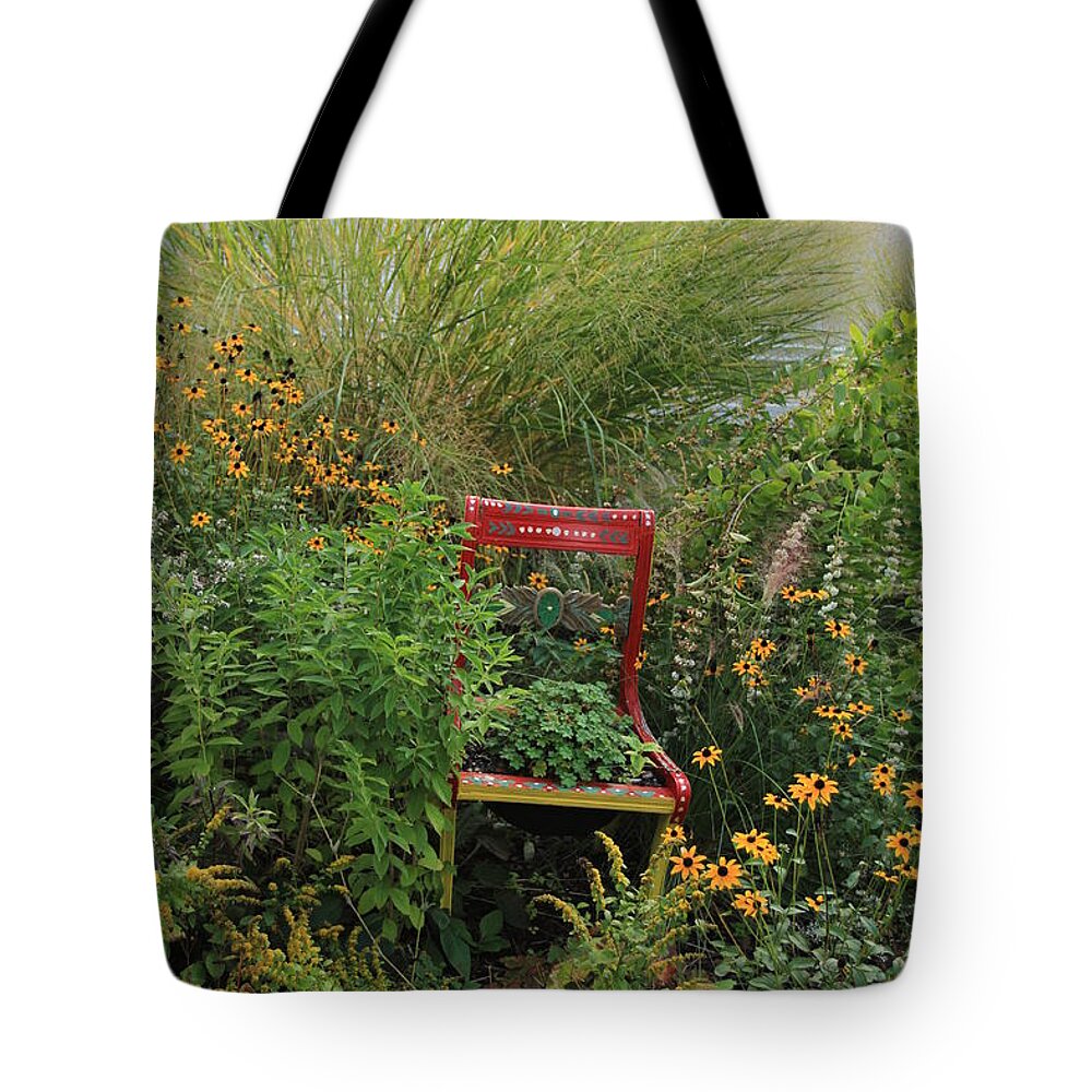 Flowering Bridge Tote Bag featuring the photograph Red Chair in Garden by Karen Ruhl
