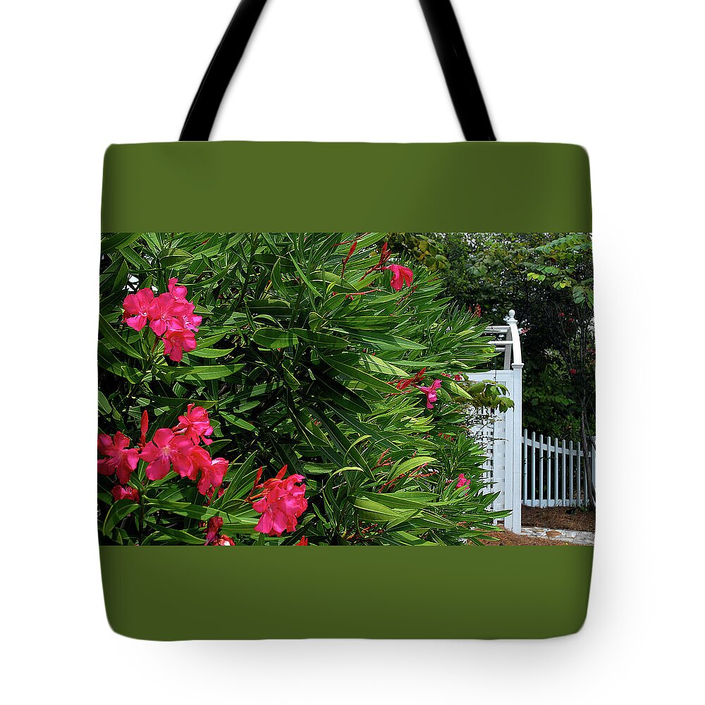 Red Tote Bag featuring the photograph Red Oleander Arbor by Marie Hicks