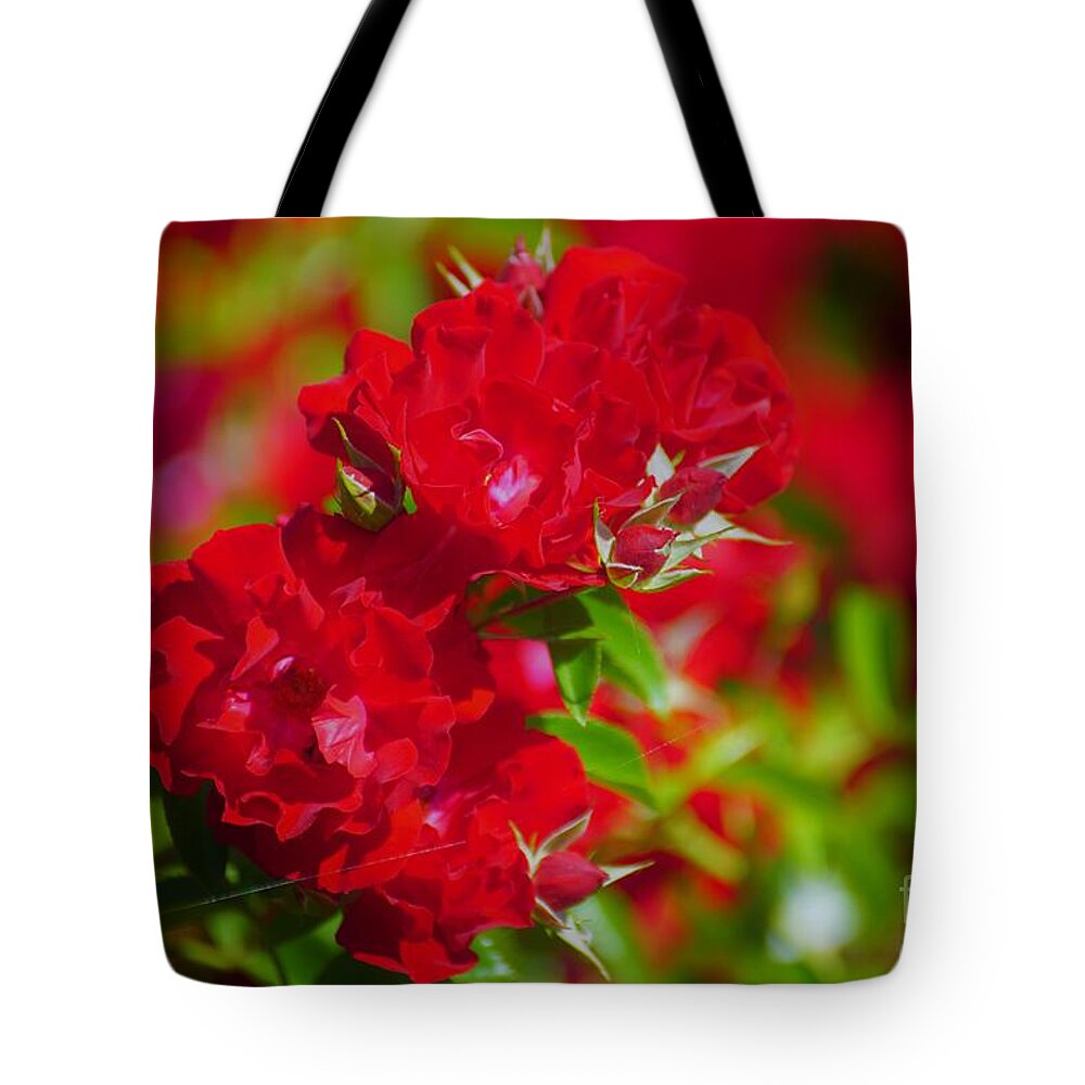 Red Tote Bag featuring the photograph Red Roses by Merle Grenz
