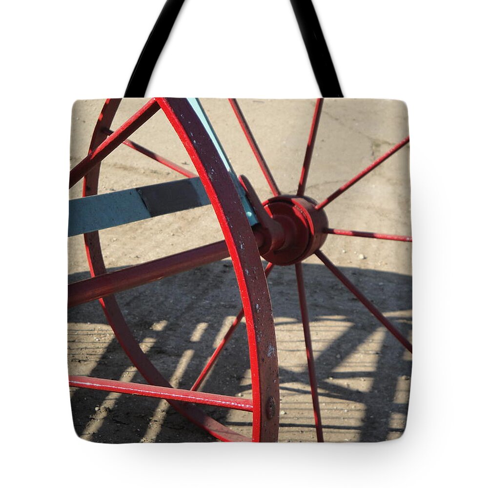 Wheel Tote Bag featuring the photograph Red Waggon wheel by Susan Baker