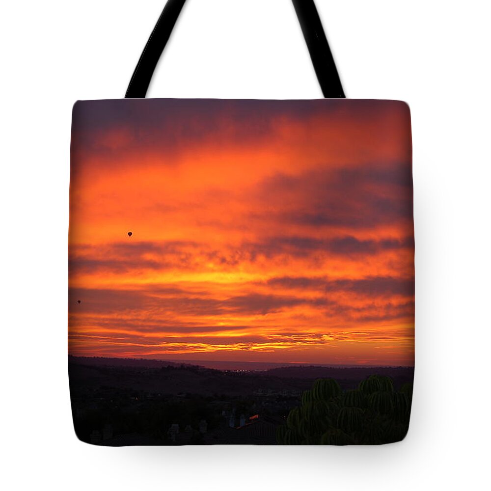 Red Tote Bag featuring the photograph Reddish afternoon by Maria Aduke Alabi