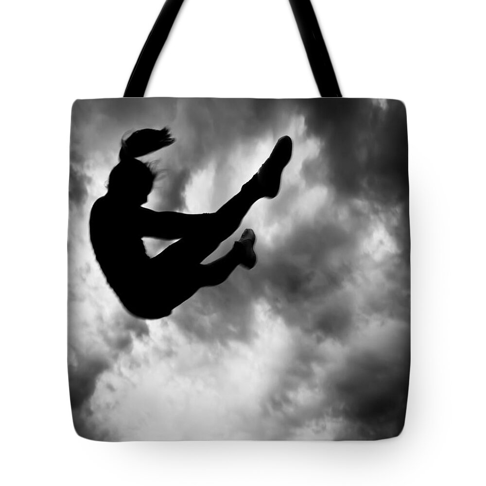 Adventure Tote Bag featuring the photograph Returning to Earth by Bob Orsillo