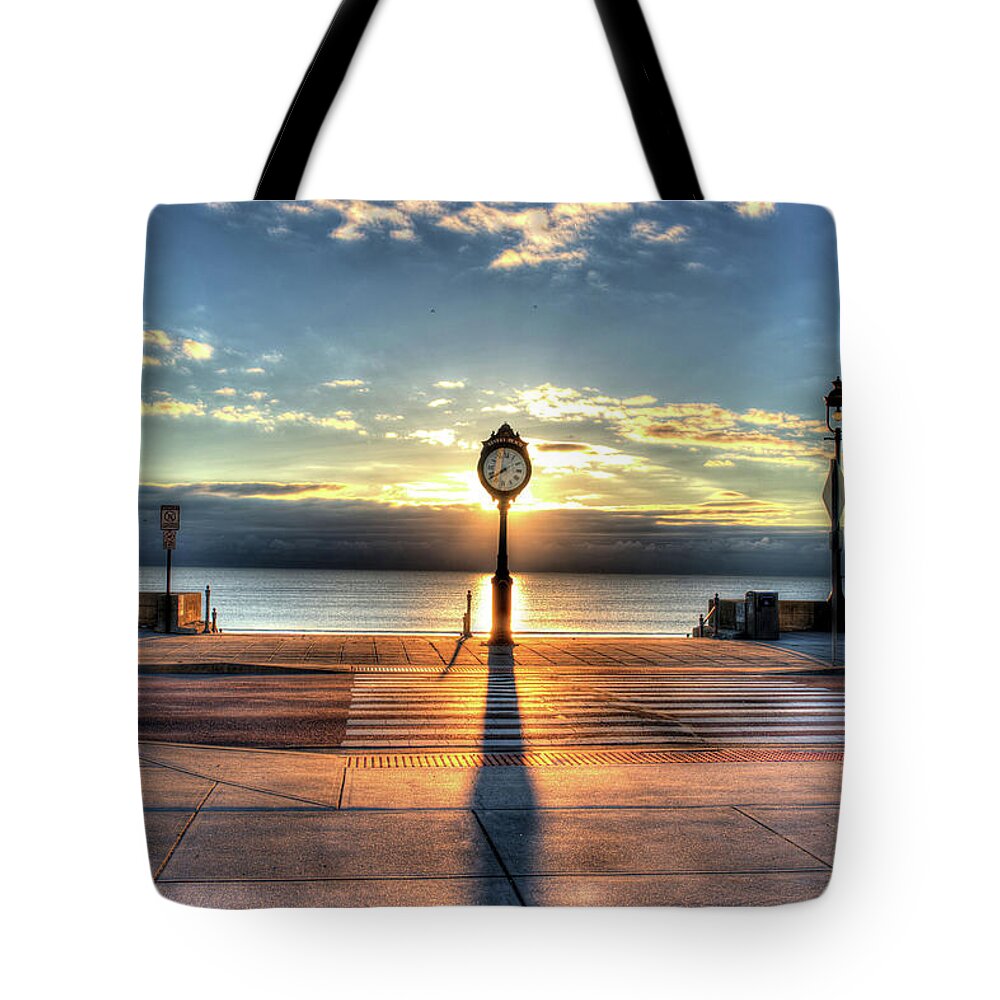 Revere Tote Bag featuring the photograph Revere Beach Clock at Sunrise Long Shadow Revere MA by Toby McGuire