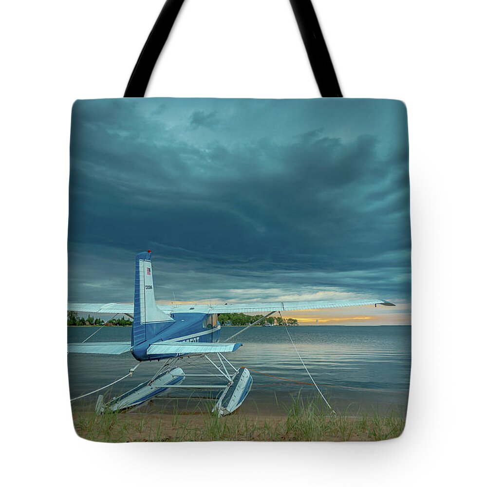 Grand Marais Mi Tote Bag featuring the photograph Riding the storm out by Gary McCormick